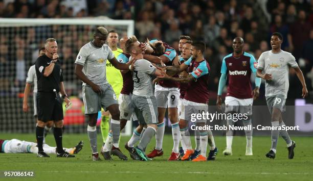 Tempers flare between West Ham United's Mark Noble and Manchester United's Paul Pogba after a challenge by Pogba on the West Ham man. Luke Shaw and...