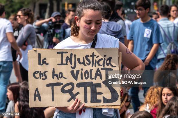 Young woman is seen with a sign with the text "Injustice has violated us all". Under the slogan "it's not abuse, it's rape" more than 5,000 high...