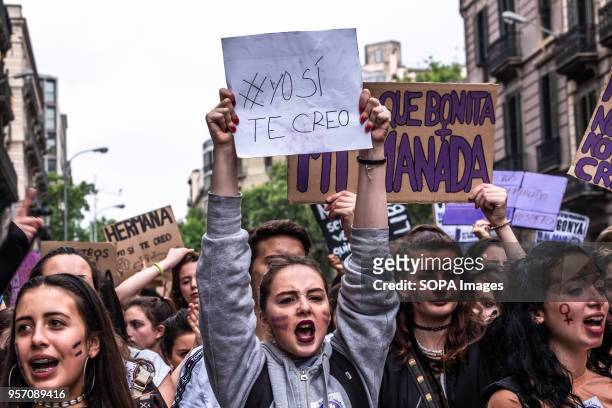 Young woman is seen showing a sign with the text "I do believe you". Under the slogan "it's not abuse, it's rape" more than 5,000 high school and...