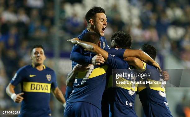 Pablo Perez of Boca Juniors celebrates with teammates after scoring the opening goal during a match between Gimnasia y Esgrima La Plata and Boca...