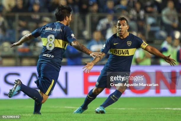 Pablo Perez of Boca Juniors celebrates with teammate Carlos Tevez after scoring the opening goal during a match between Gimnasia y Esgrima La Plata...