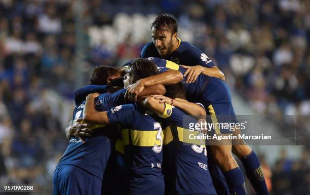 Pablo Perez of Boca Juniors celebrates with teammates after scoring the opening goal during a match between Gimnasia y Esgrima La Plata and Boca...