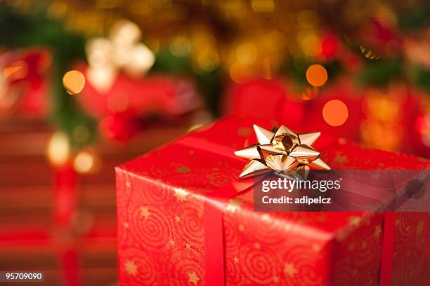 sparkling christmas present - gift under christmas tree stock pictures, royalty-free photos & images