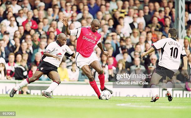 Patrick Vieira of Arsenal takes on Luis Boa Morte and John Collins of Fulham during the FA Barclaycard Premiership match at Craven Cottage in London....