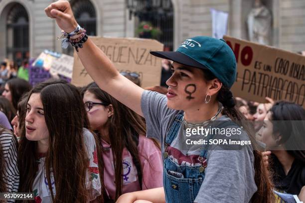 Protester is seen with his fist raised and the sign of the woman painted on his face. Under the slogan "it's not abuse, it's rape" more than 5,000...