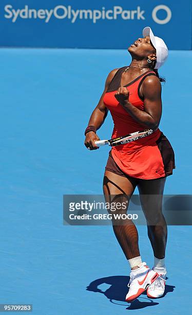 Serena Williams of the US shows her delight at winning a game during her match against Maria Jose Martinez Sanchez of Spain at the Sydney...