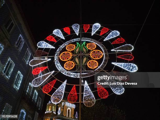string lights during night ofthe feast of crosses (barcelos - portugal) - braga district stock-fotos und bilder