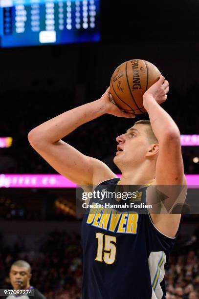 Nikola Jokic of the Denver Nuggets shoots the ball against the Minnesota Timberwolves during the game on April 11, 2018 at the Target Center in...