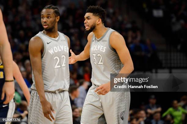 Andrew Wiggins and Karl-Anthony Towns of the Minnesota Timberwolves look on during the game against the Denver Nuggets on April 11, 2018 at the...