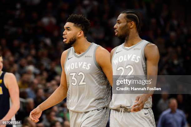 Andrew Wiggins and Karl-Anthony Towns of the Minnesota Timberwolves look on during the game against the Denver Nuggets on April 11, 2018 at the...