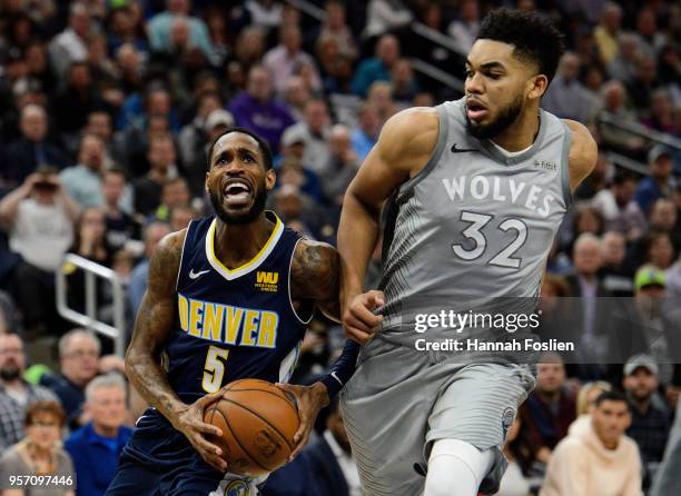 Will Barton of the Denver Nuggets shoots the ball against Karl-Anthony Towns of the Minnesota Timberwolves during the game on April 11, 2018 at the...