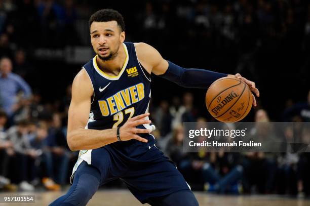 Jamal Murray of the Denver Nuggets dribbles the ball against the Minnesota Timberwolves during the game on April 11, 2018 at the Target Center in...