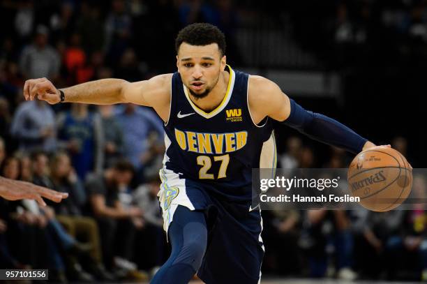 Jamal Murray of the Denver Nuggets dribbles the ball against the Minnesota Timberwolves during the game on April 11, 2018 at the Target Center in...