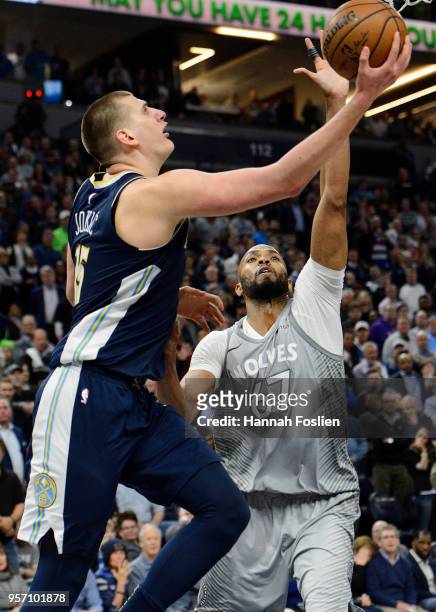 Nikola Jokic of the Denver Nuggets shoots the ball against Taj Gibson of the Minnesota Timberwolves during the game on April 11, 2018 at the Target...