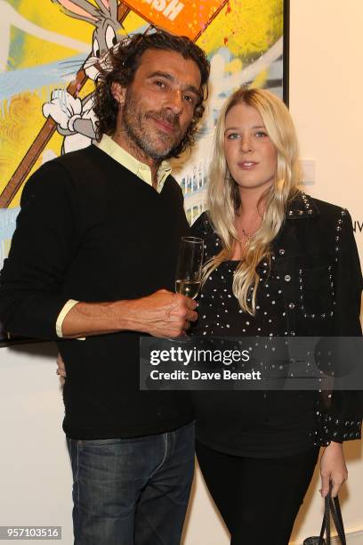 Derrick Santini and Gracie Egan attend Once Upon A Time by contemporary Irish street artist Robyn Ward on May 10, 2018 in London, England.