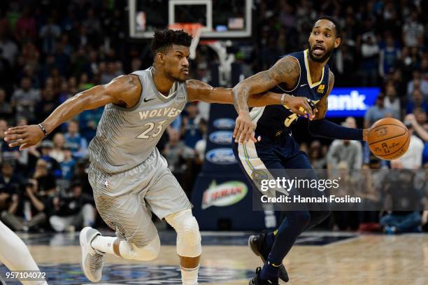 Will Barton of the Denver Nuggets dribbles the ball against Jimmy Butler of the Minnesota Timberwolves during the game on April 11, 2018 at the...