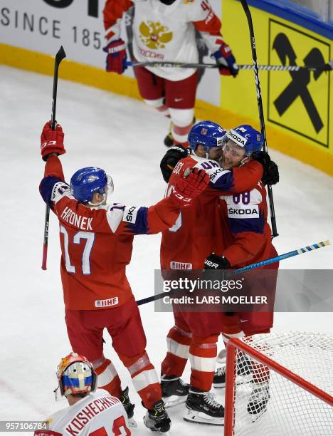 David Pastrnak of Czech Republic celebrates with teammates David Krejcik and Filip Hronek after scoring the game winning goal in overtime during IIHF...