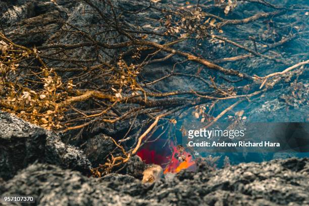 Lava is seen coming from a fissure on May 9, 2018 in Leilani Estates, Hawaii. The first Hawaiian house was consumed this week by the months-long,...
