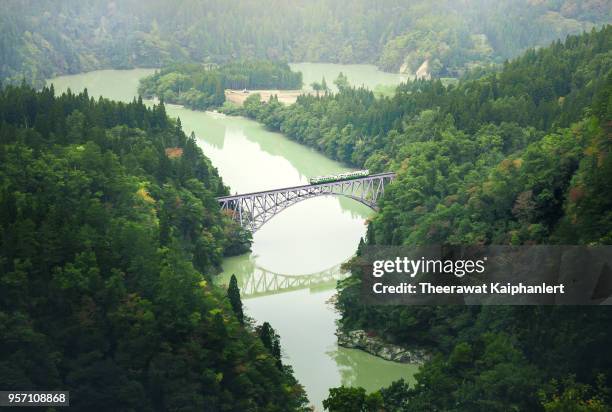 famous tadami train line on the iron bridge in fukushima, tohoku, japan - landschaft asien schiene stock-fotos und bilder