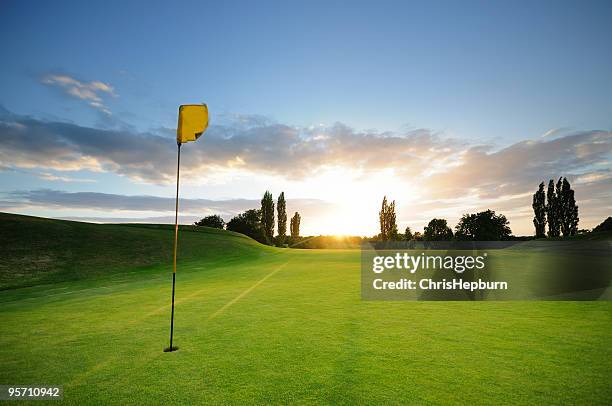 sunset over the 18th - golf course hole stock pictures, royalty-free photos & images