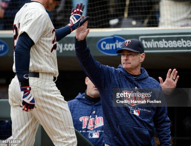 Manager Paul Molitor of the Minnesota Twins congratulates Max Kepler on a home run against the Houston Astros during the game on April 11, 2018 at...