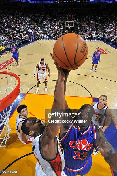 Shaquille O'Neal of the Cleveland Cavaliers takes a contested shot against the Golden State Warriors on January 11, 2010 at Oracle Arena in Oakland,...