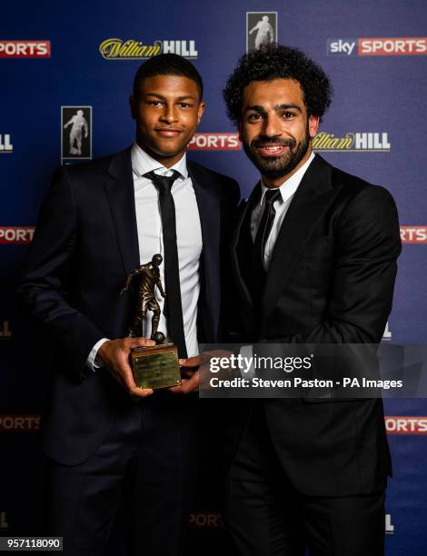 Liverpool's Mohamed Salah poses with his FWA Footballer of the Year 2018 award alongside team-mate Rhian Brewster during the FWA Footballer of the...