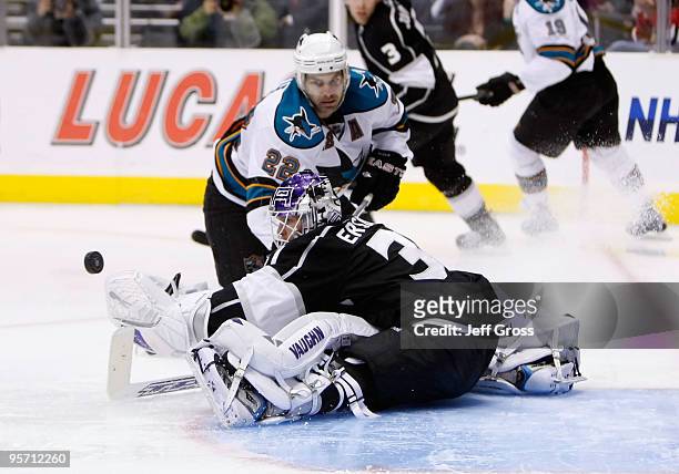 Goaltender Erik Ersberg of the Los Angeles Kings makes a save on Dan Boyle of the San Jose Sharks in the first period at Staples Center on January...