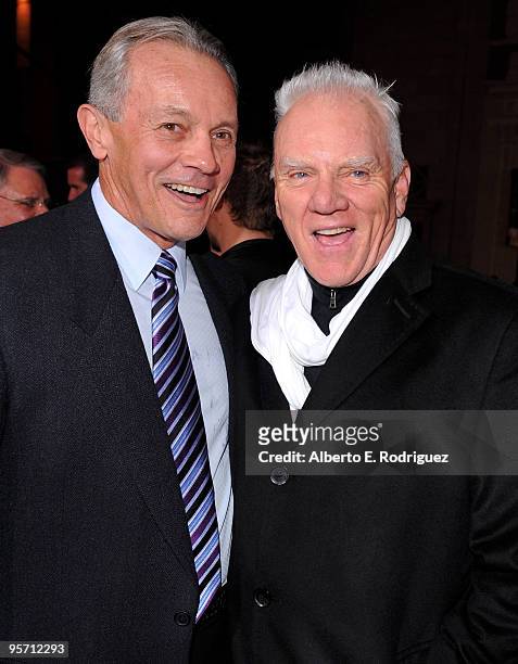 Producer David Valdes and actor Malcolm McDowell arrive at the premiere of Warner Bros. 'The Book Of Eli' held at Grauman's Chinese Theatre on...
