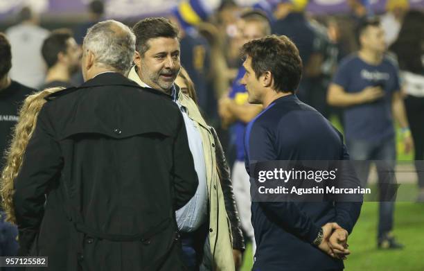 Daniel Angelici, President of Boca Juniors, talks to Guillermo Barros Schelotto, coach of Boca Juniors during the celebration event after winning the...