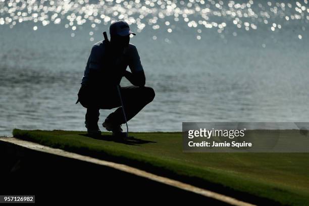 Brendan Steele of the United States lines up a putt on the 16th green during the first round of THE PLAYERS Championship on the Stadium Course at TPC...
