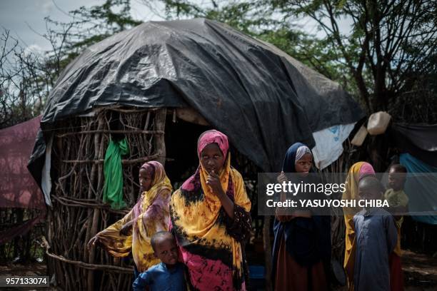 Group of Somali refugee children stand at Dadaab refugee camp complex, in the north-east of Kenya, on April 16, 2018. Two years ago Kenya's...