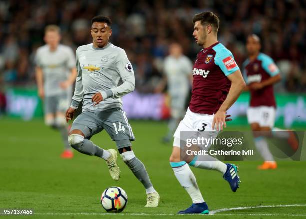 Jesse Lingard of Manchester United in action with Aaron Cresswell of West Ham United during the Premier League match between West Ham United and...