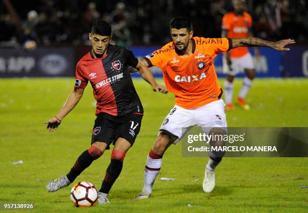 Braian Rivero of Argentinian Newell's vies for the ball with Lucho Gonzalez of Brazilian Paranaense during a Copa Sudamericana 2018 football match at...