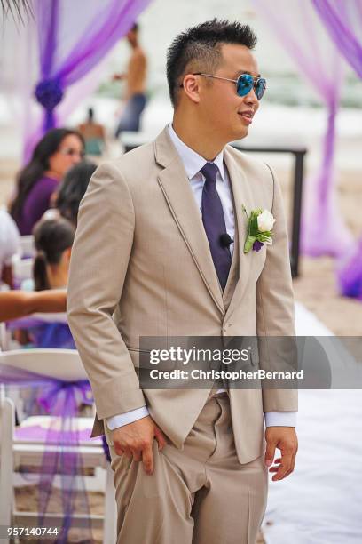 smiling asian groom waiting at the alter - wedding ceremony alter stock pictures, royalty-free photos & images