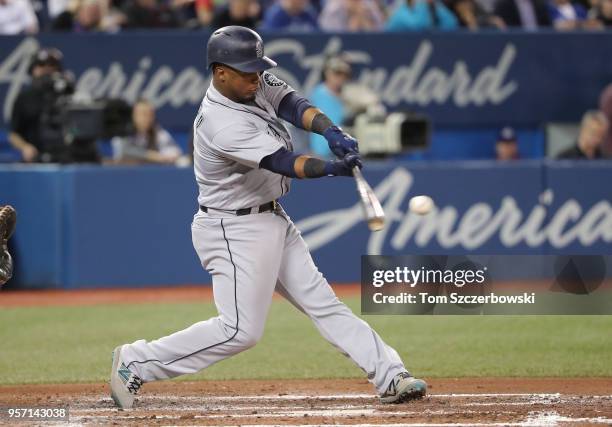 Jean Segura of the Seattle Mariners hits a single in the fourth inning during MLB game action against the Toronto Blue Jays at Rogers Centre on May...