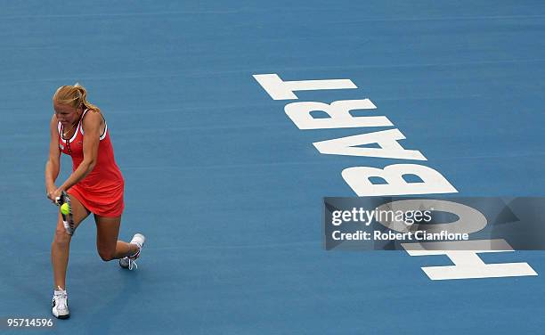 Alla Kudryavtseva of Russia plays a backhand in her second round singles match against Anabel Medina Garrigues of Spain during day five of the...