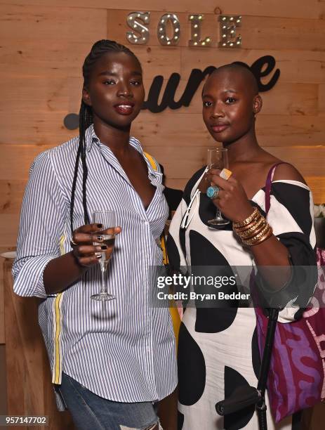 Models Seynabou Cisse and blogger Mama Cax attend as DSW celebrates the launch of the DSW VIP rewards program at Root NYC on May 10, 2018 in New York...