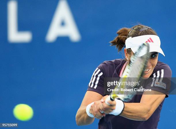 Anabel Medina Garrigues of Spain plays a backhand in her second round singles match against Alla Kudryavtseva of Russia during day five of the...