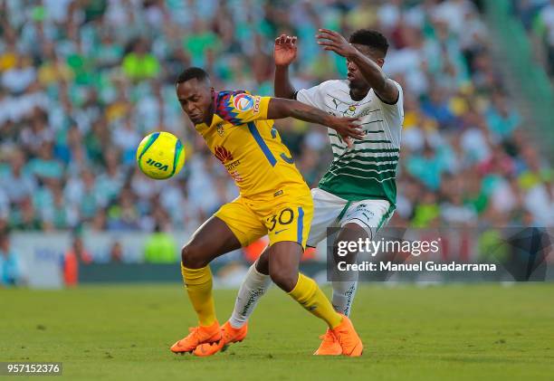 Renato Ibarra of America and Djaniny Tavares of Santos during the semifinals first leg match between Santos Laguna and America as part of the Torneo...