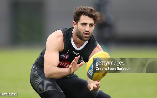 Alex Fasolo of the Magpies runs with the ball during a Collingwood Magpies AFL media session at the Holden Centre on May 11, 2018 in Melbourne,...