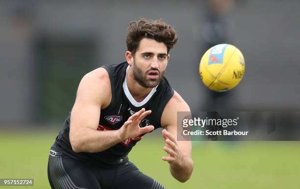 Alex Fasolo of the Magpies runs with the ball during a Collingwood Magpies AFL media session at the Holden Centre on May 11, 2018 in Melbourne,...