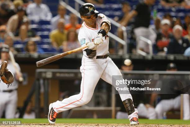 Martin Prado of the Miami Marlins hits an RBI single in the fifth inning against the Atlanta Braves at Marlins Park on May 10, 2018 in Miami, Florida.
