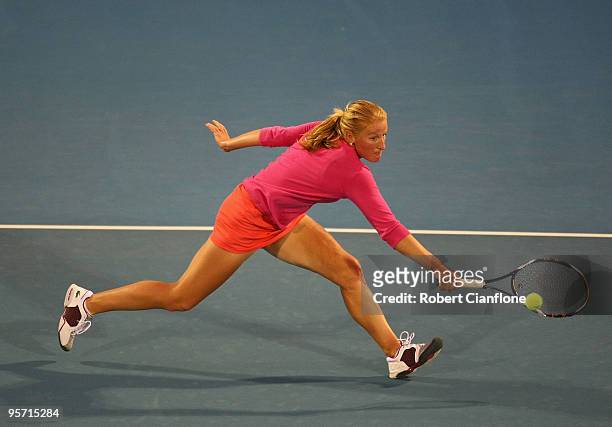 Alla Kudryavtseva of Russia plays a backhand in her second round singles match against Anabel Medina Garrigues of Spain during day five of the...