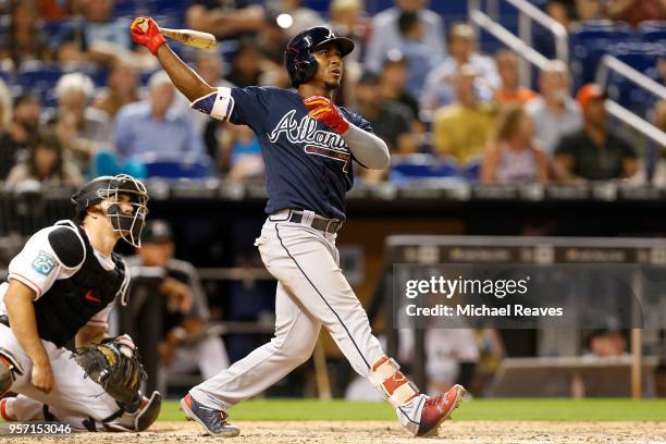 Ozzie Albies of the Atlanta Braves hits a grand slam in the sixth inning against the Miami Marlins at Marlins Park on May 10, 2018 in Miami, Florida.