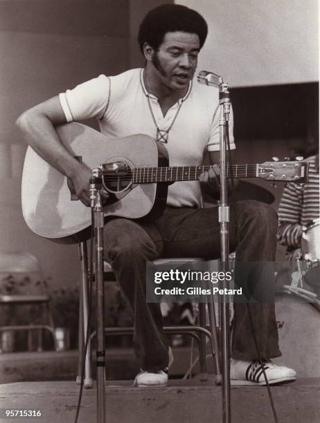 Bill Withers performs on stage in 1972.