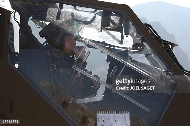 French Tigre helicopter pilot enjoys a meal in between sorties at the FOB Morales-Frazier in Nijrab in Kapisa province on January 10, 2010. About...