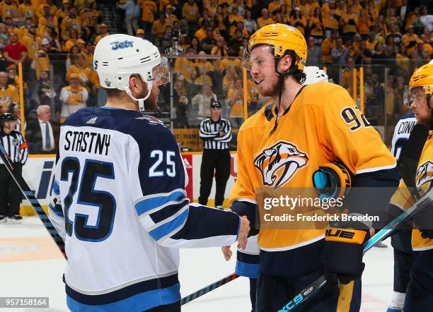 Ryan Johansen of the Nashville Predators congratulates Paul Stastny of the Winnipeg Jets after a 5-1 Jets Victory in Game Seven of the Western...