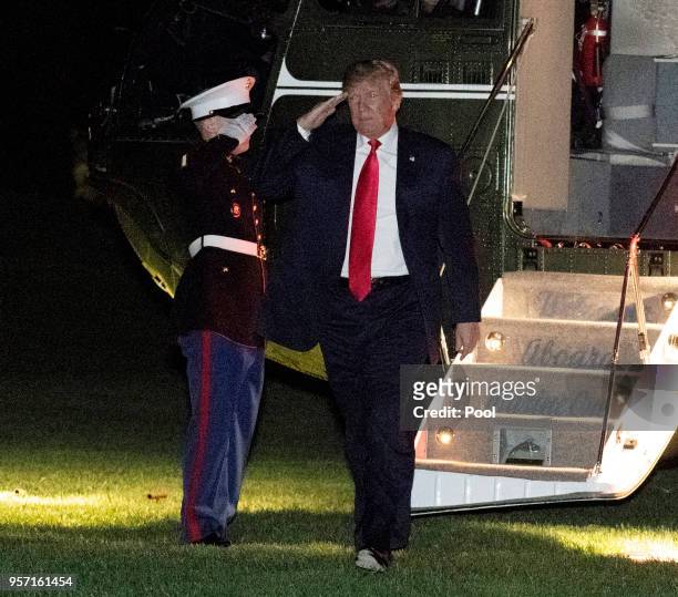 President Donald Trump salutes on his return to the White House May 10, 2018 in Washington, DC. The president hosted a rally for supporters at the...