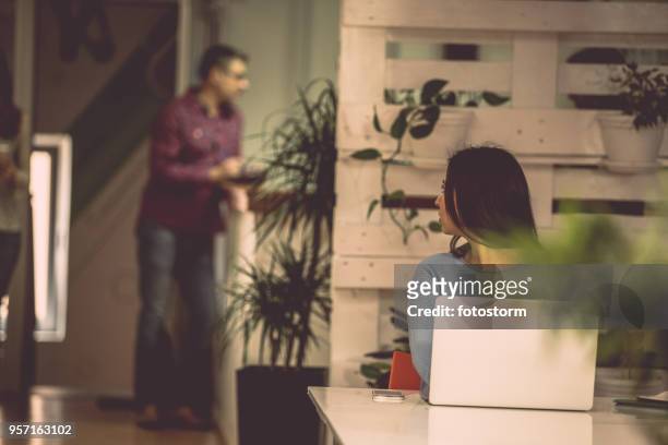 secretary listening to colleagues - eavesdropping stock pictures, royalty-free photos & images